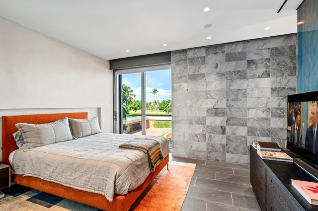 a view of a city that has tall buildings and a big yard