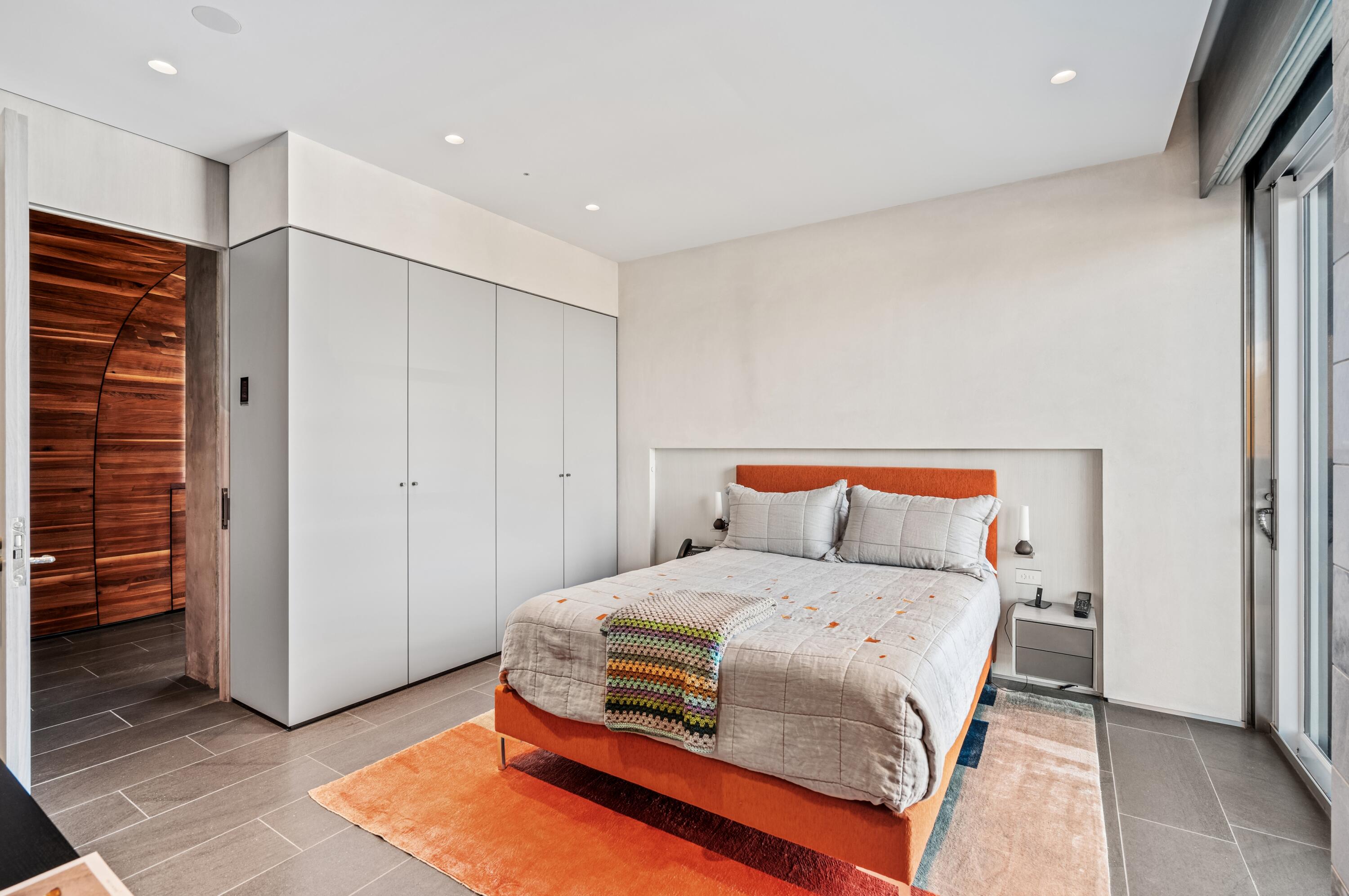 2 North Breakers Row, Unit N25 Palm Beach, FL 33480 - Photo 34 of 79 a bedroom with a bed and a cabinets