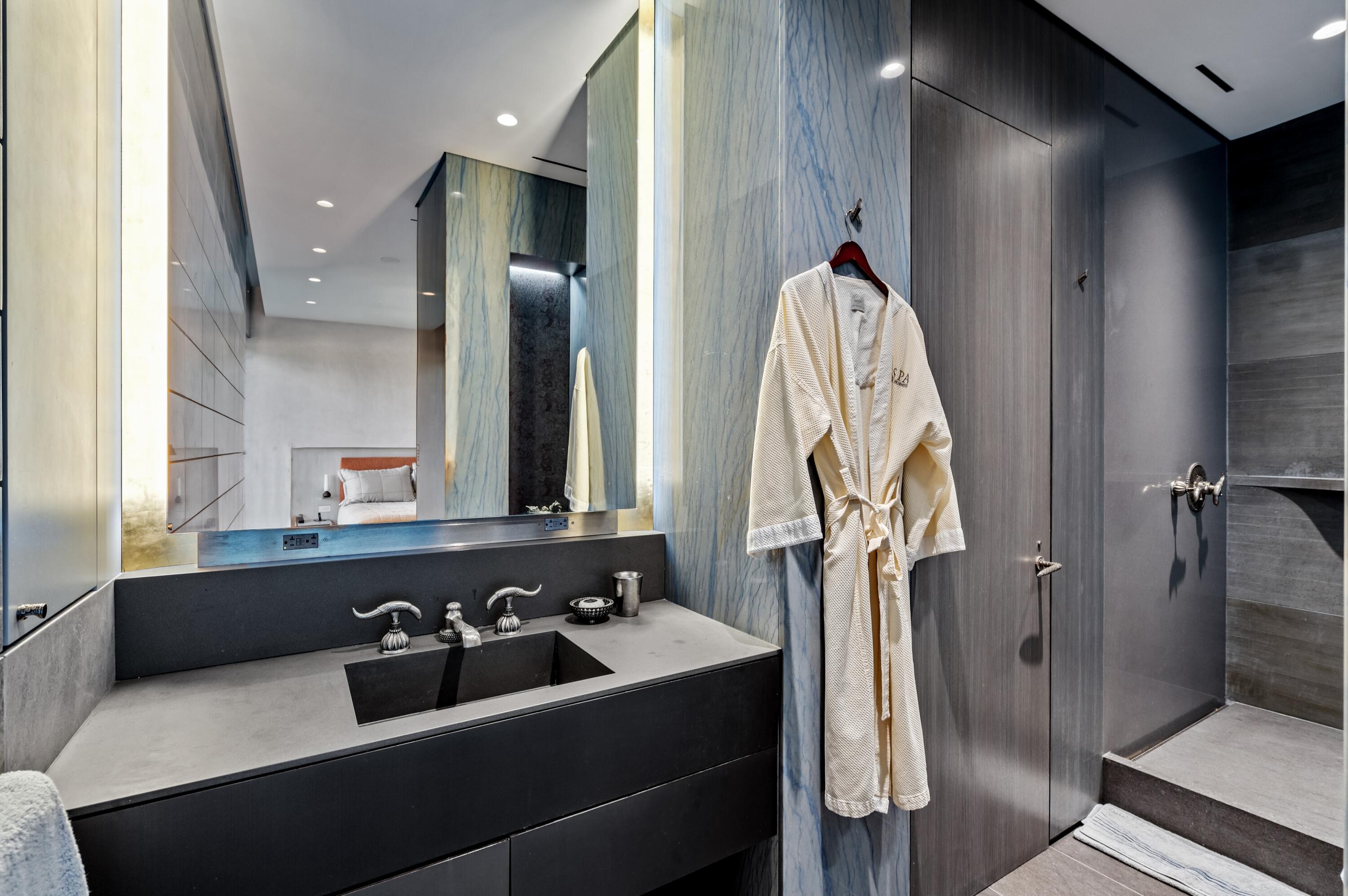 2 North Breakers Row, Unit N25 Palm Beach, FL 33480 - Photo 36 of 79 a bathroom with a sink and a mirror