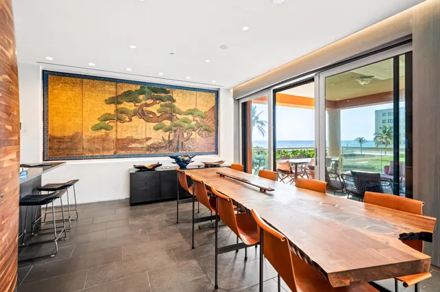 a dining room with a table and chairs