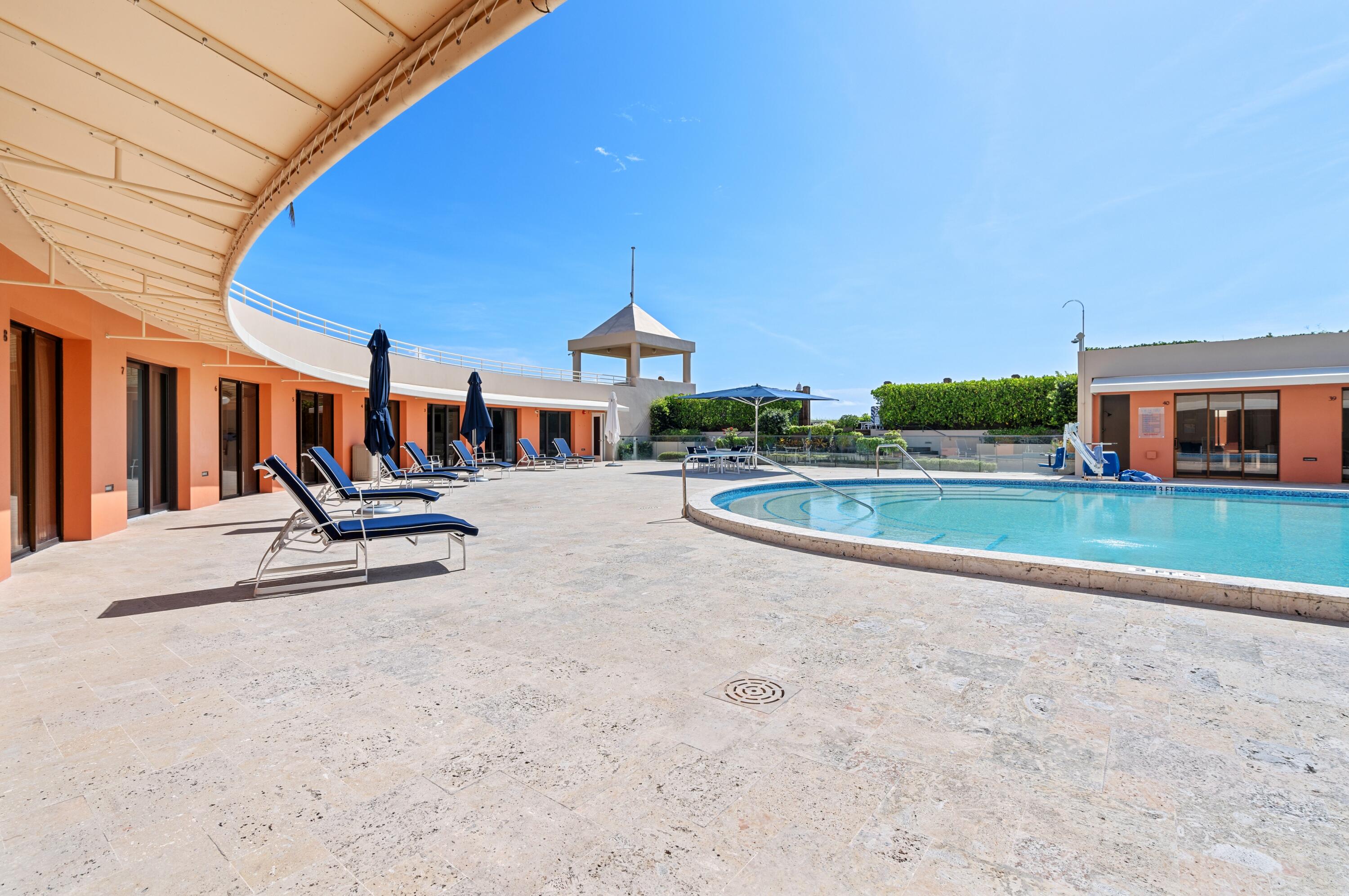 2 North Breakers Row, Unit N25 Palm Beach, FL 33480 - Photo 69 of 79 a swimming pool with outdoor seating and yard