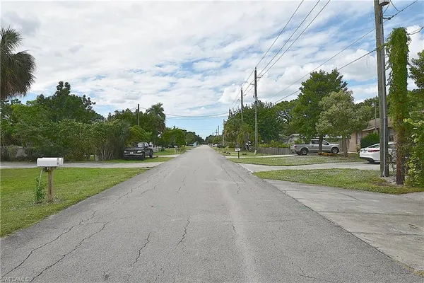 a street sign on a pole on a street
