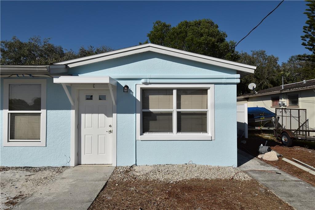 3125 Barrett Avenue Naples, FL 34112 - Photo 2 of 14 a front view of a house