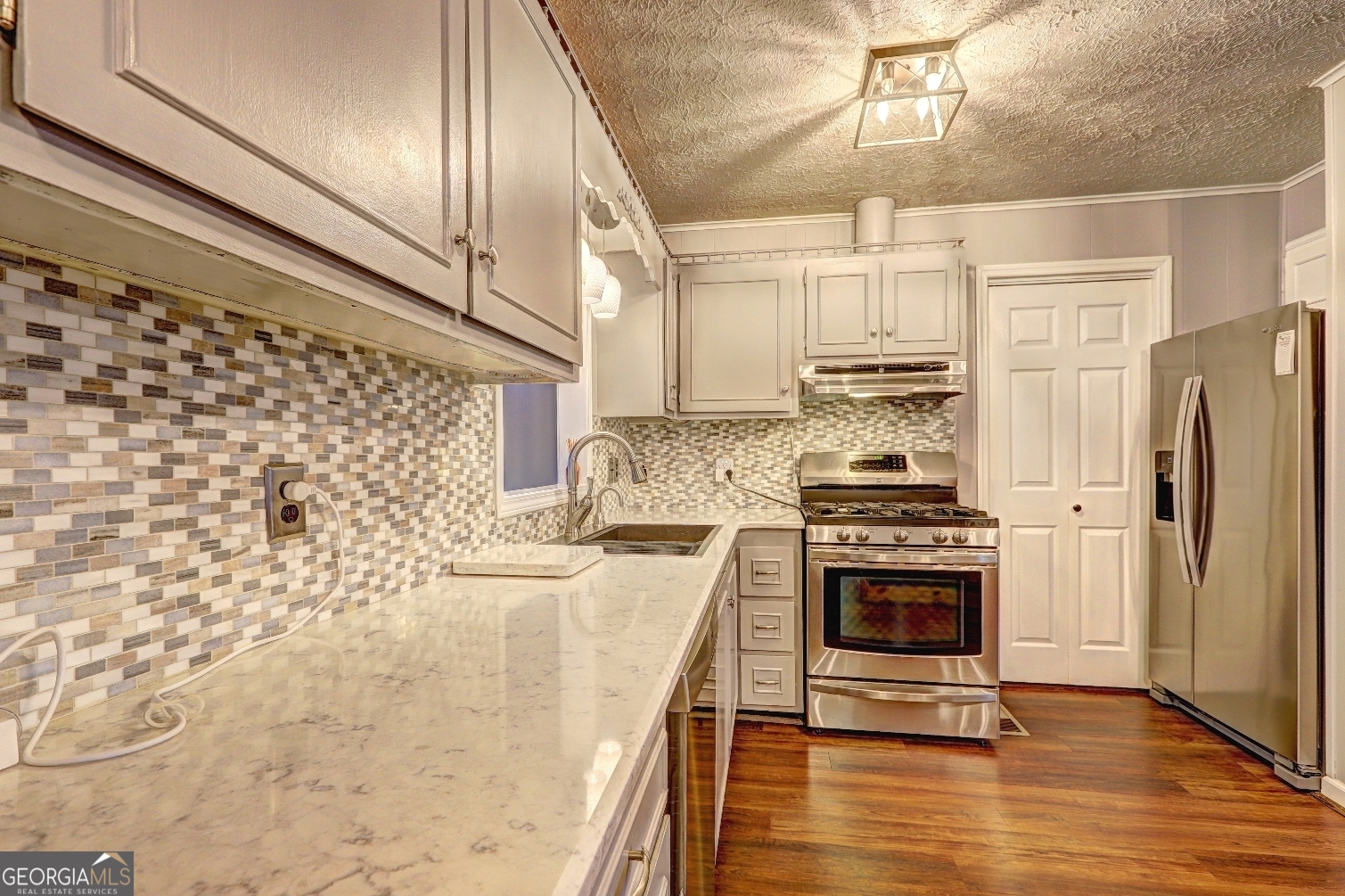 218 City Pond Road Barnesville, GA 30204 - Photo 13 of 51 a kitchen with granite countertop a stove and a refrigerator