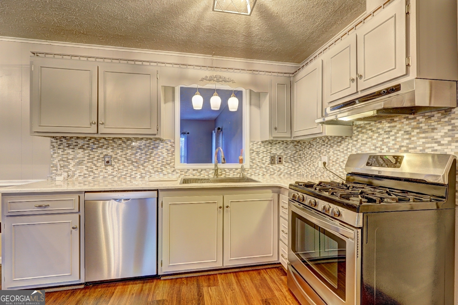 218 City Pond Road Barnesville, GA 30204 - Photo 14 of 51 a kitchen with granite countertop white cabinets and white appliances
