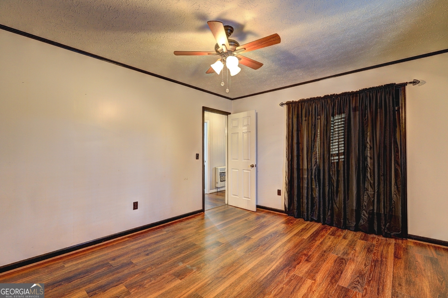 218 City Pond Road Barnesville, GA 30204 - Photo 22 of 51 wooden floor in an empty room with a window