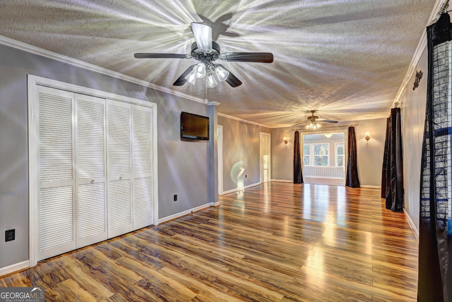 218 City Pond Road Barnesville, GA 30204 - Photo 27 of 51 a view of an empty room with wooden floor and a window