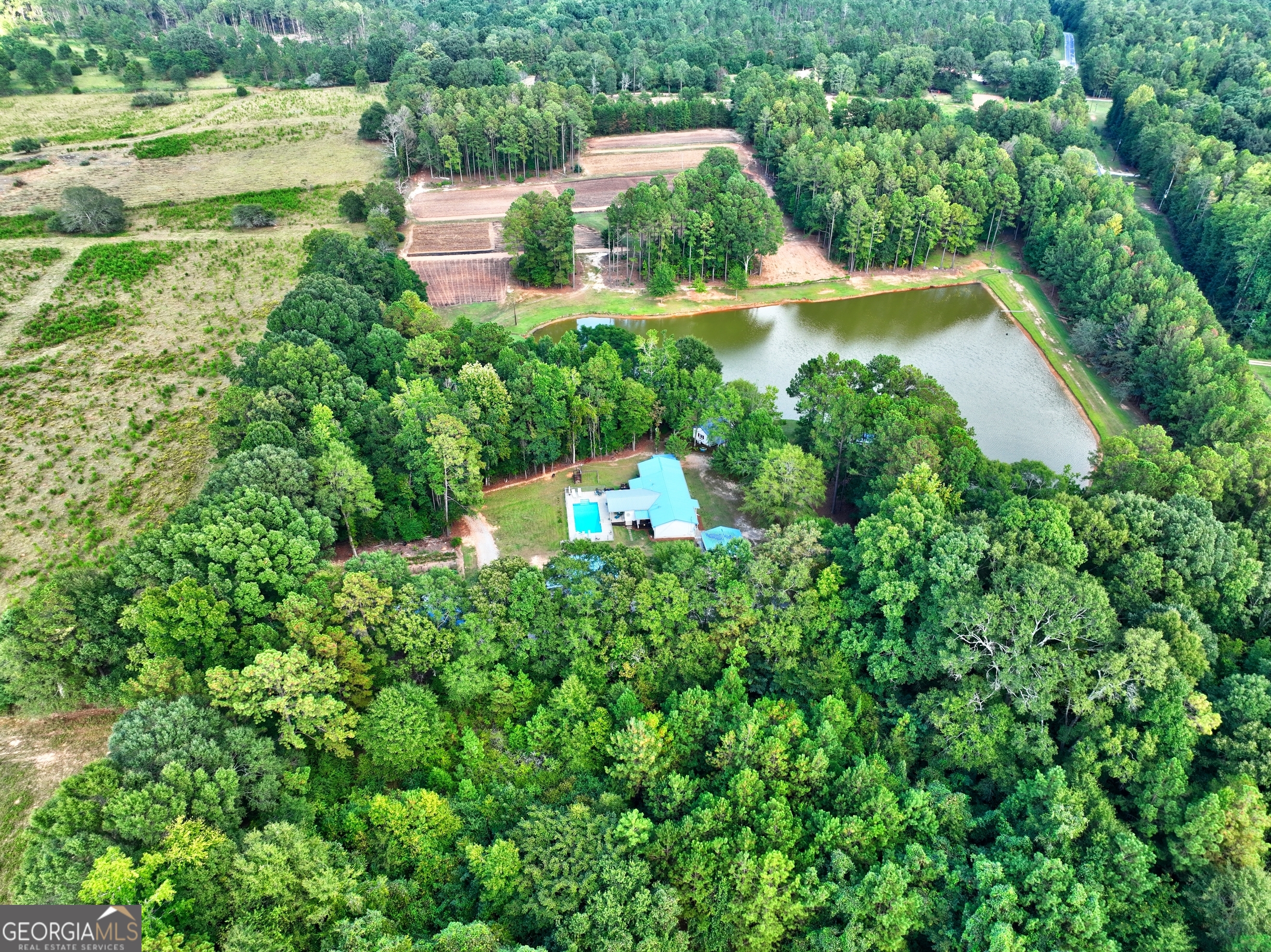 218 City Pond Road Barnesville, GA 30204 - Photo 49 of 51 an aerial view of a house with a yard and lake view