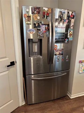 a view of a refrigerator and microwave
