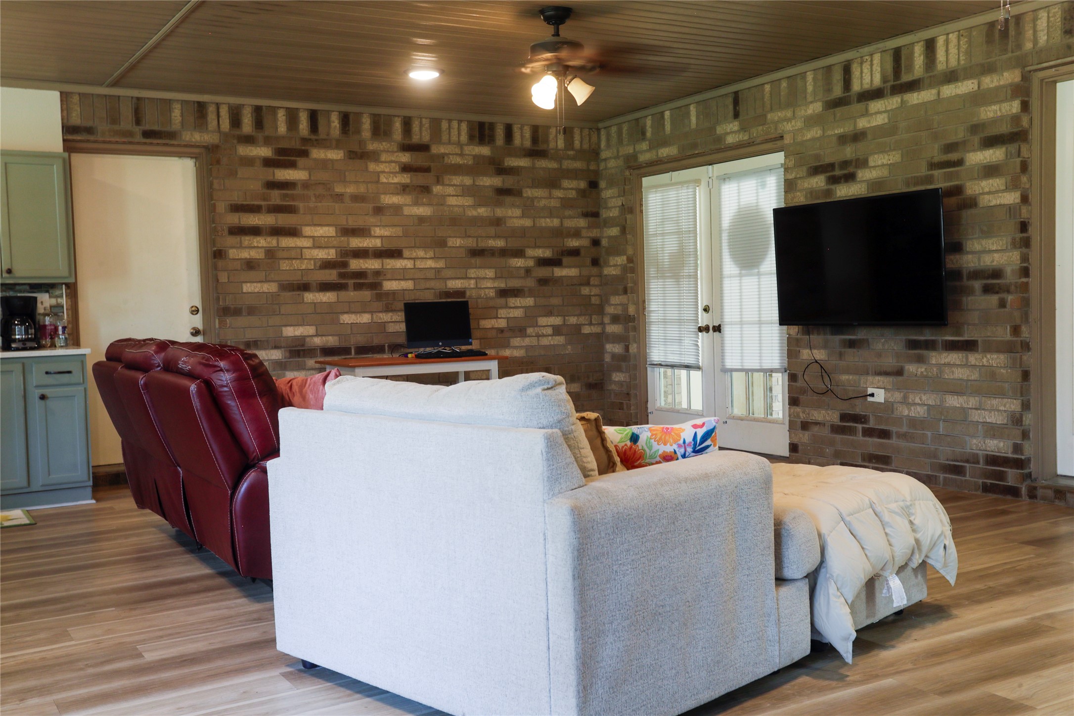 2012 Wilson Road El Campo, TX 77437 - Photo 31 of 50 a bedroom with a bed a flat screen tv and a fireplace