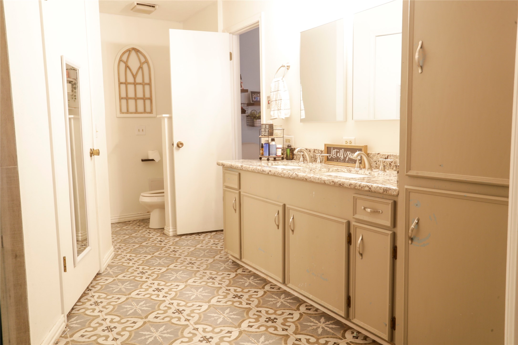 2012 Wilson Road El Campo, TX 77437 - Photo 36 of 50 a bathroom with a sink and a mirror