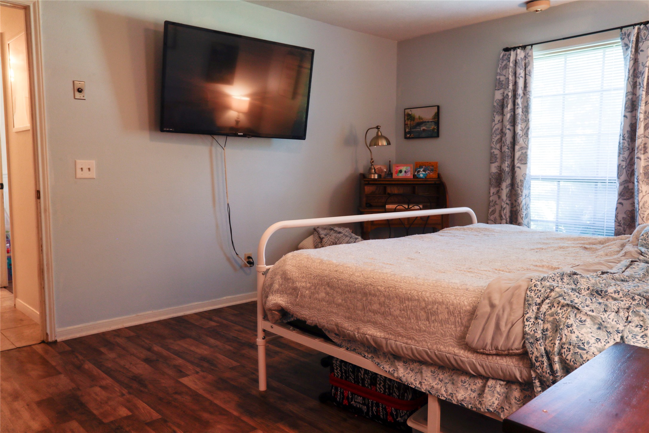 2012 Wilson Road El Campo, TX 77437 - Photo 38 of 50 a bedroom with a bed and a flat screen tv