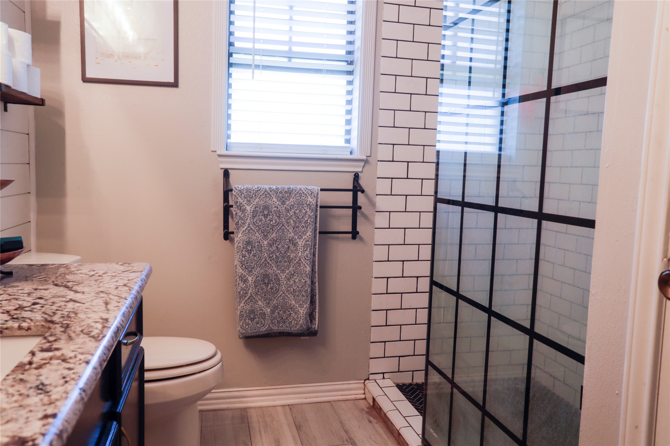 2012 Wilson Road El Campo, TX 77437 - Photo 41 of 50 a bathroom with a granite countertop toilet and a shower