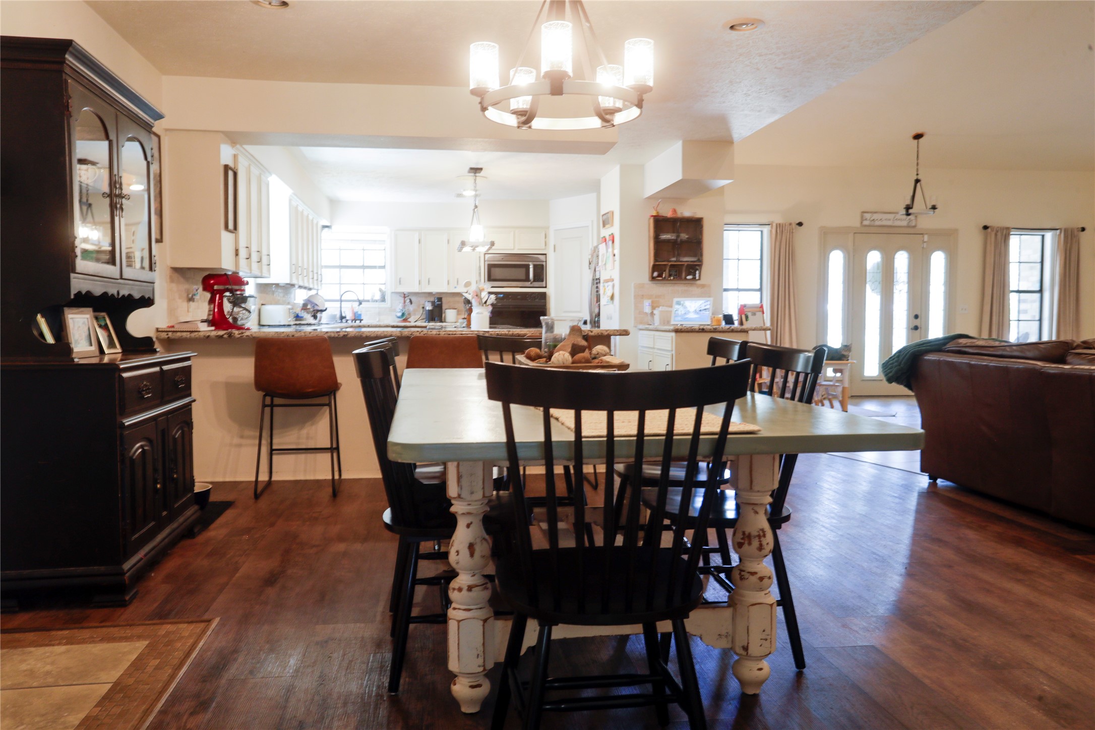2012 Wilson Road El Campo, TX 77437 - Photo 45 of 50 a view of a dining room with furniture window and wooden floor