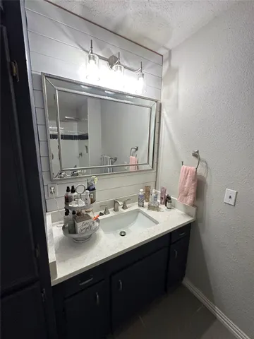 a bathroom with a sink double vanity and a mirror