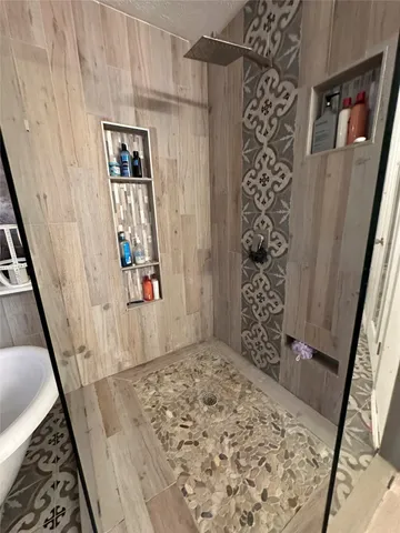 view of a hallway with wooden floor and entryway