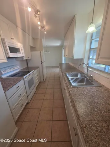 a bathroom with a sink a vanity and a mirror