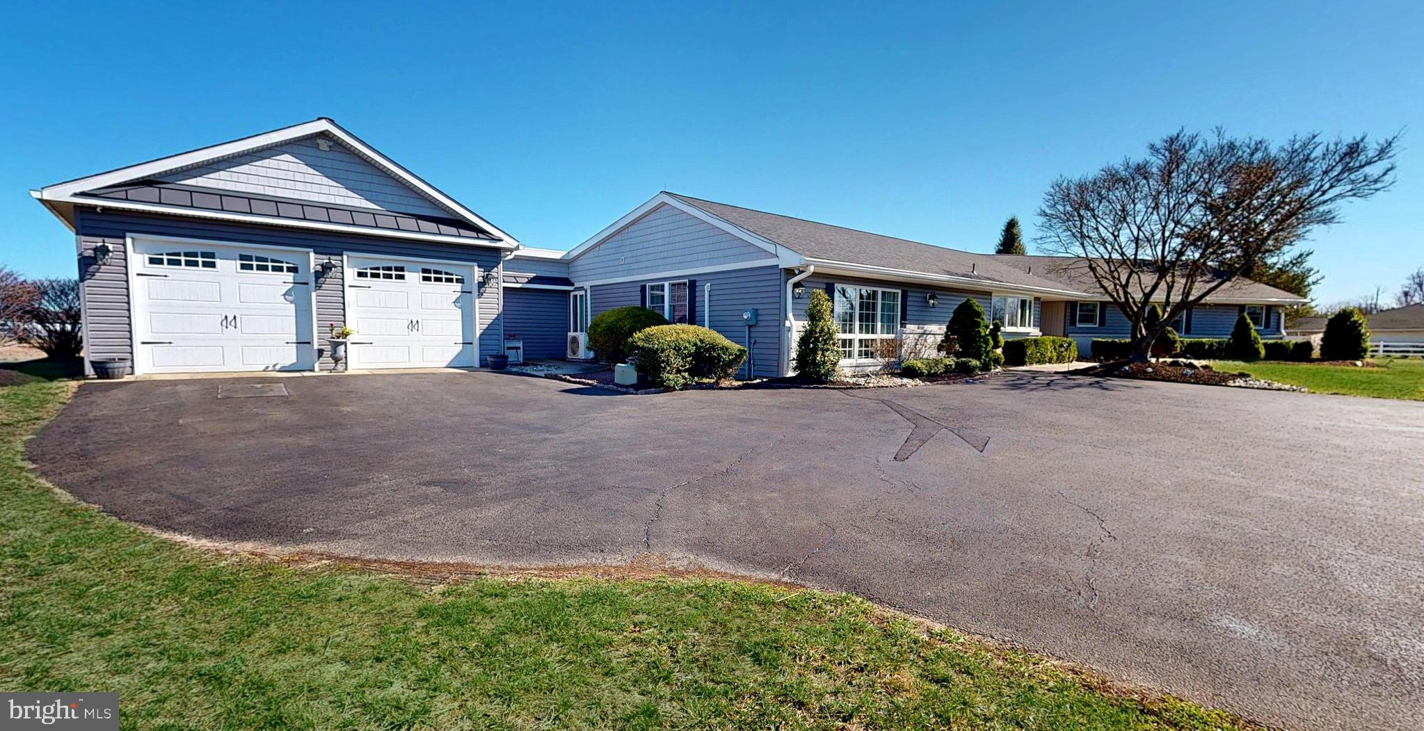 1400 Old Indian Mills Road Shamong, NJ 08088 - Photo 15 of 110 a front view of a house with a yard and garage