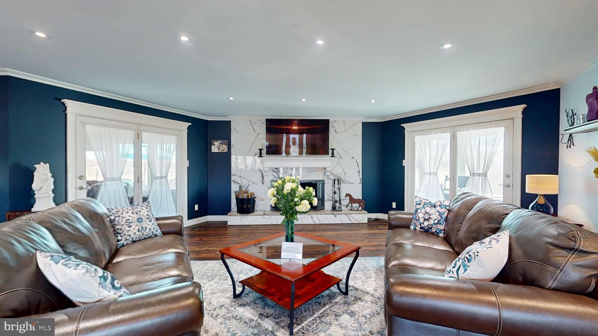 1400 Old Indian Mills Road Shamong, NJ 08088 - Photo 19 of 110 a living room with furniture a fireplace and a window