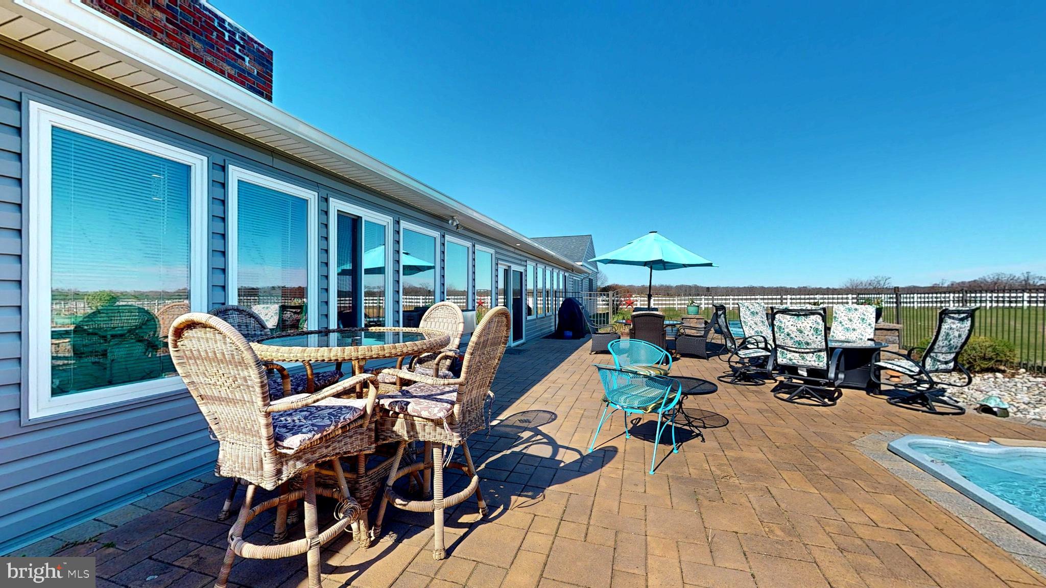 1400 Old Indian Mills Road Shamong, NJ 08088 - Photo 87 of 110 a view of a patio with table and chairs under an umbrella