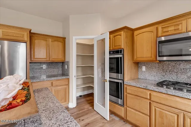 an aerial view of a house with swimming pool and ocean view