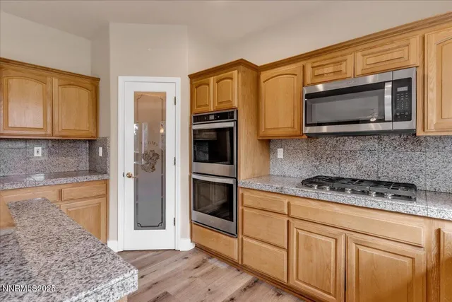 an aerial view of a house with swimming pool and ocean view