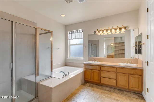 a view of a dry yard with wooden fence
