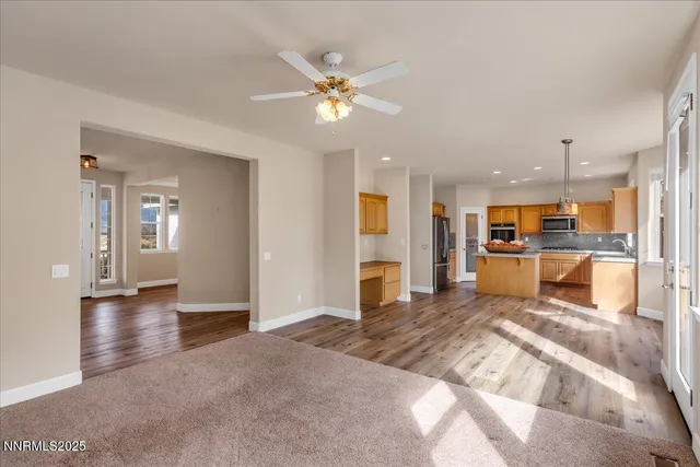 a kitchen with stainless steel appliances granite countertop a stove microwave and cabinets