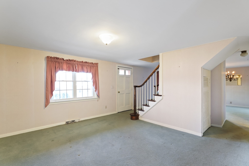 22 Coolidge Road Walpole, MA 02081 - Photo 4 of 25 a view of an empty room with a window