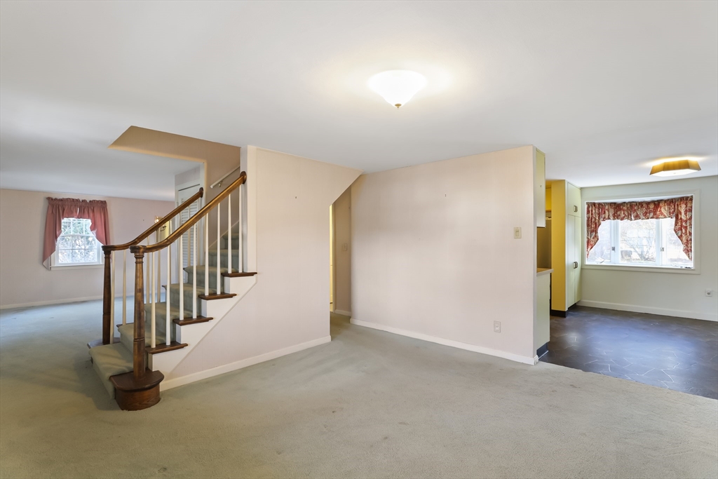 22 Coolidge Road Walpole, MA 02081 - Photo 5 of 25 a view of an empty room with stairs