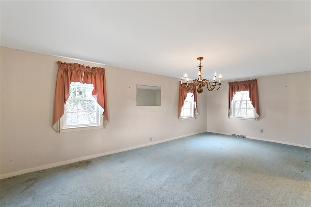 22 Coolidge Road Walpole, MA 02081 - Photo 6 of 25 an empty room with windows and closet