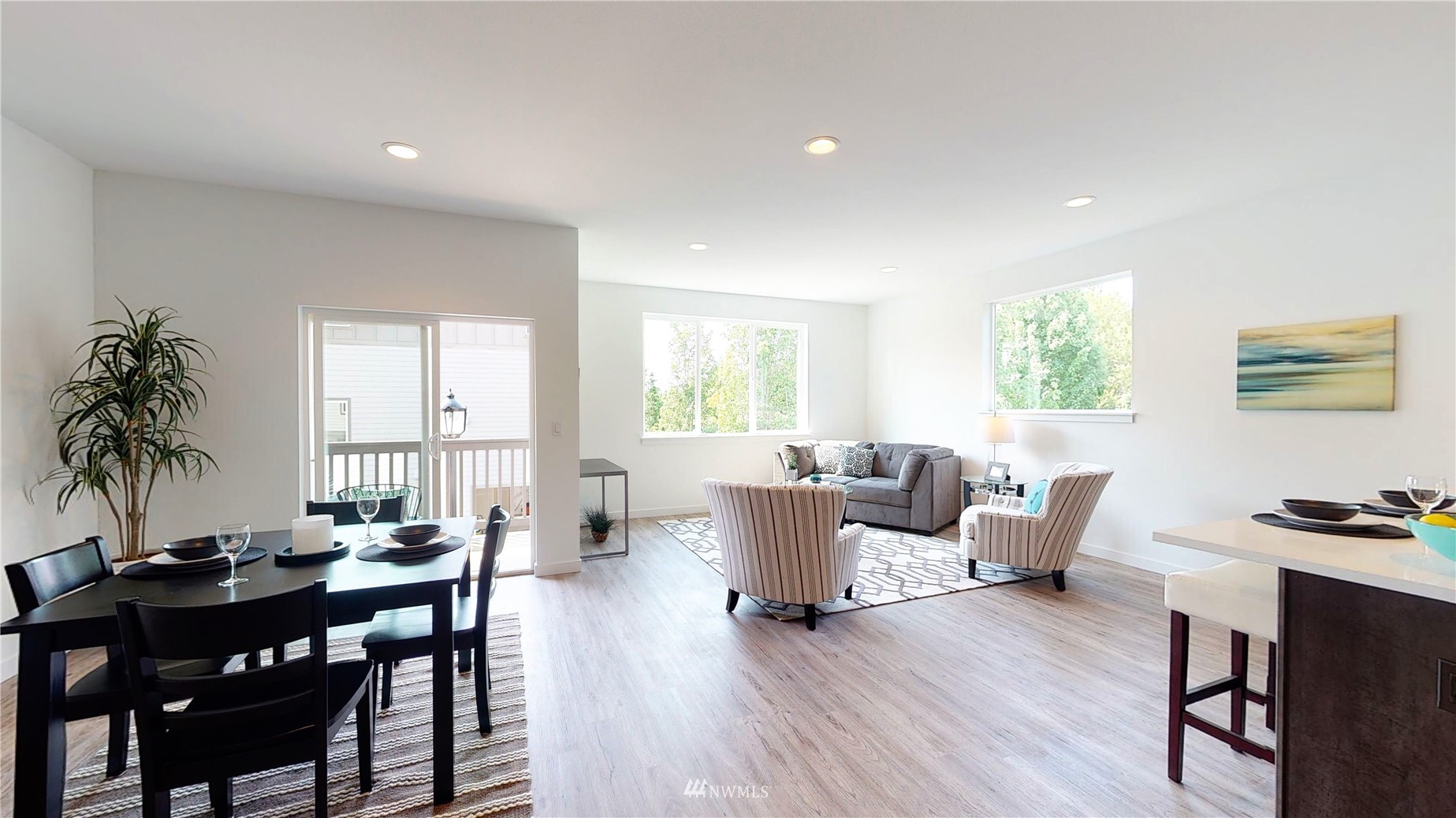 319 South 48th Court, Unit 13 Renton, WA 98055 - Photo 11 of 33 a view of a dining room with furniture window and wooden floor