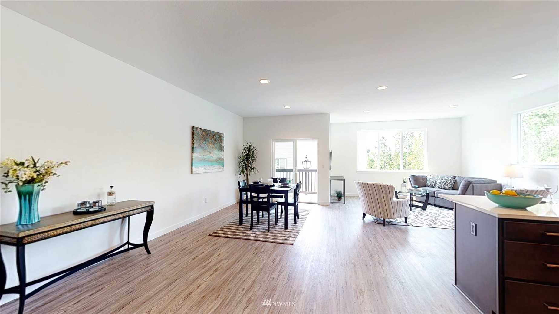 319 South 48th Court, Unit 13 Renton, WA 98055 - Photo 12 of 33 a living room with furniture wooden floor dining table and a window