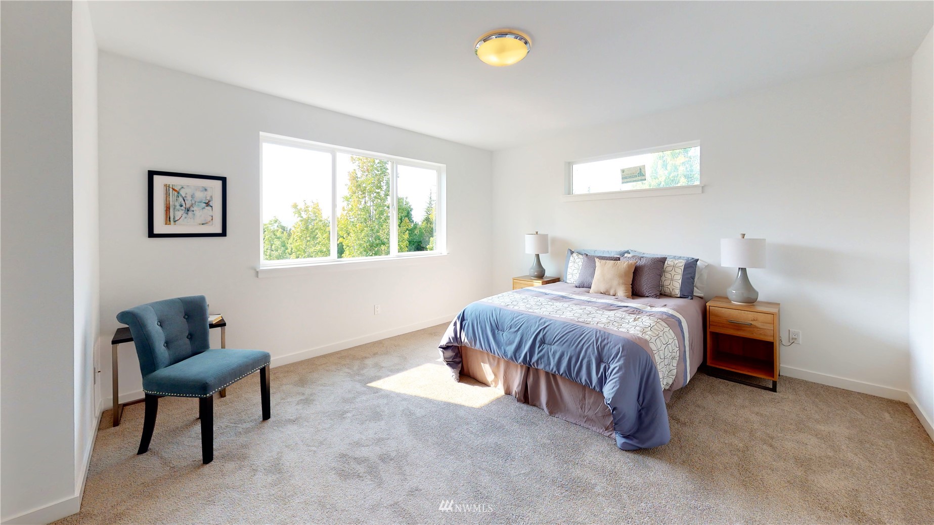 319 South 48th Court, Unit 13 Renton, WA 98055 - Photo 19 of 33 a spacious bedroom with a bed and a chair