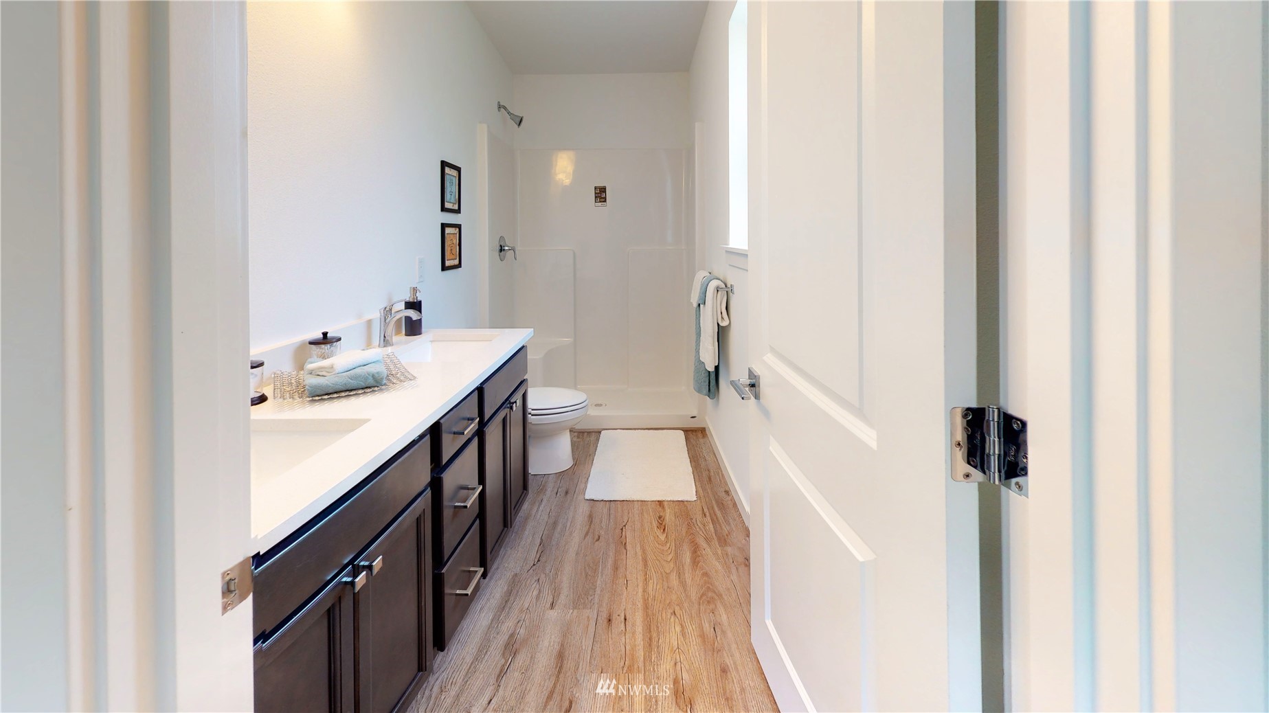 319 South 48th Court, Unit 13 Renton, WA 98055 - Photo 21 of 33 a bathroom with a double vanity sink and a mirror