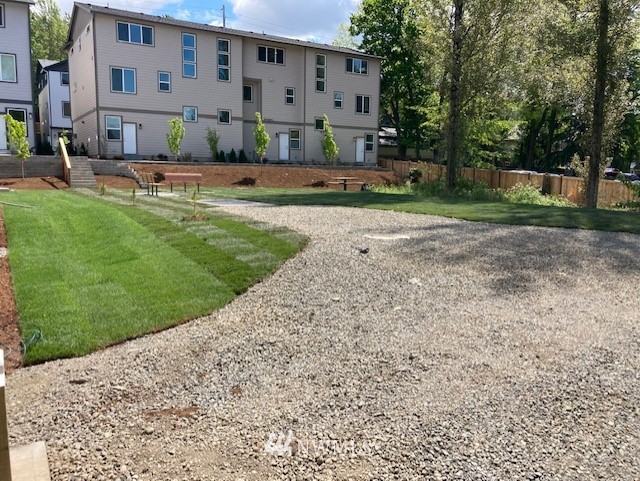 319 South 48th Court, Unit 13 Renton, WA 98055 - Photo 27 of 33 a view of backyard with outdoor seating and trees
