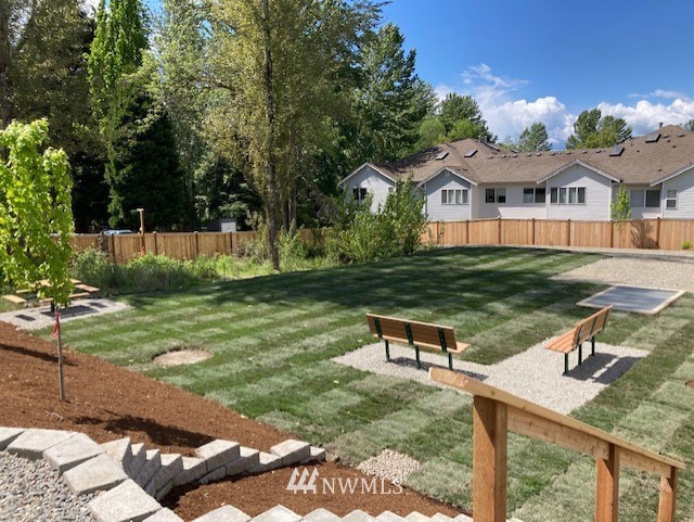 319 South 48th Court, Unit 13 Renton, WA 98055 - Photo 29 of 33 a view of a house with backyard