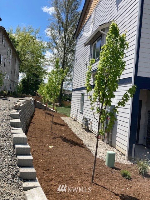 319 South 48th Court, Unit 13 Renton, WA 98055 - Photo 31 of 33 a view of a yard with plants