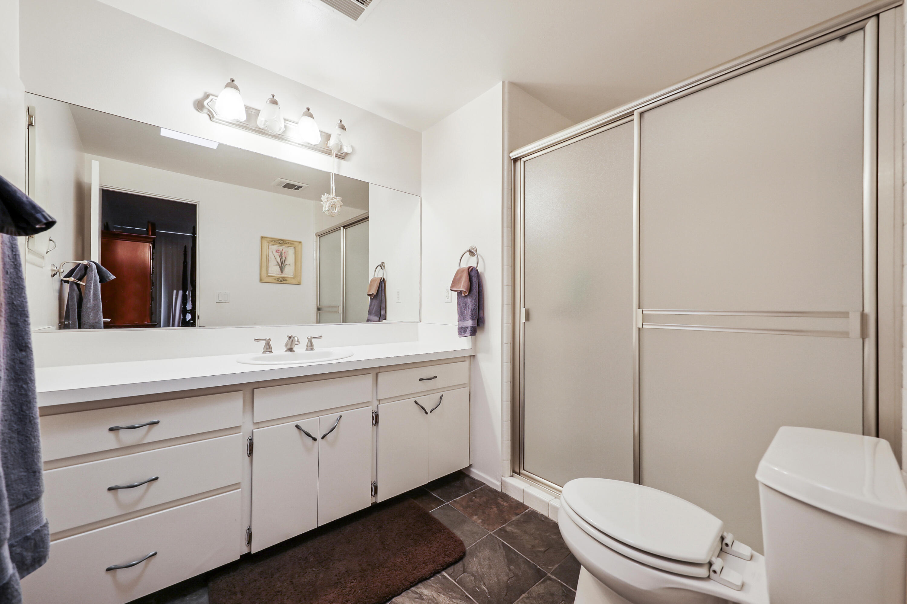 45760 Ocotillo Drive Palm Desert, CA 92260 - Photo 15 of 29 a bathroom with a double vanity sink mirror and toilet