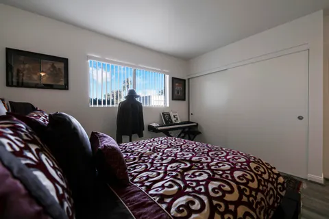 a bed room with a bed and a chair