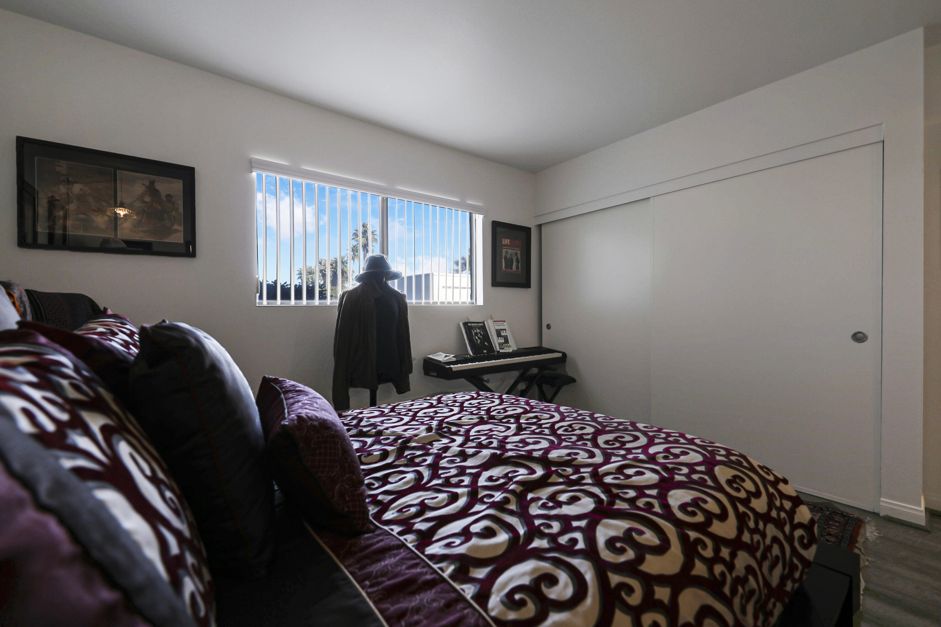 45760 Ocotillo Drive Palm Desert, CA 92260 - Photo 17 of 29 a bed room with a bed and a chair