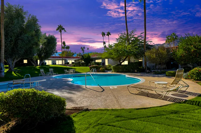 a view of a park with large trees
