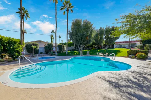 a view of a swimming pool with a patio