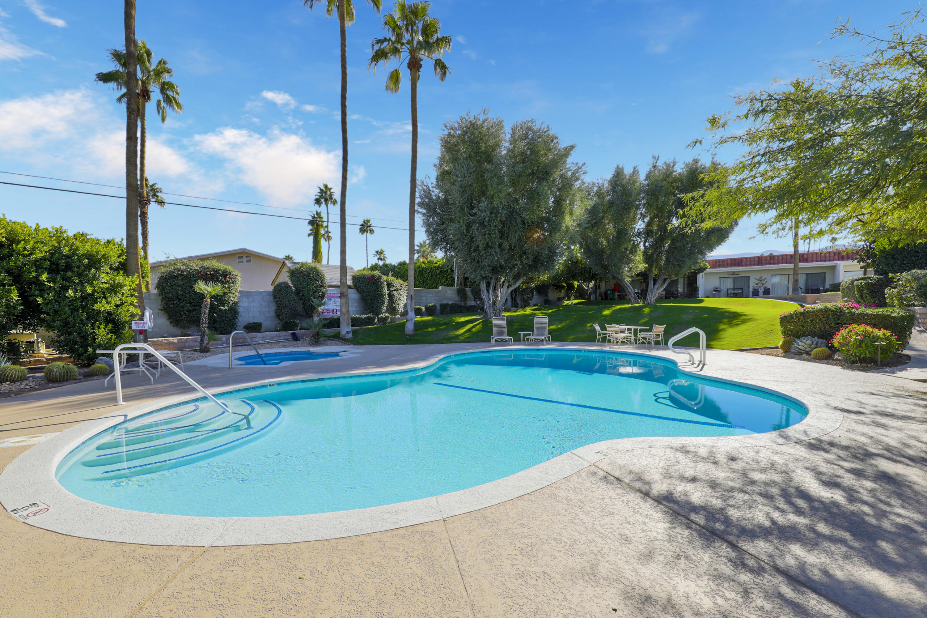 45760 Ocotillo Drive Palm Desert, CA 92260 - Photo 26 of 29 a view of a swimming pool with a patio