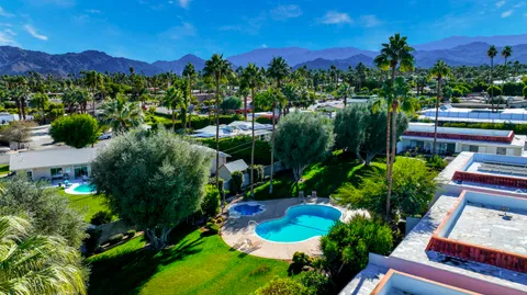 a view of a chairs in a backyard
