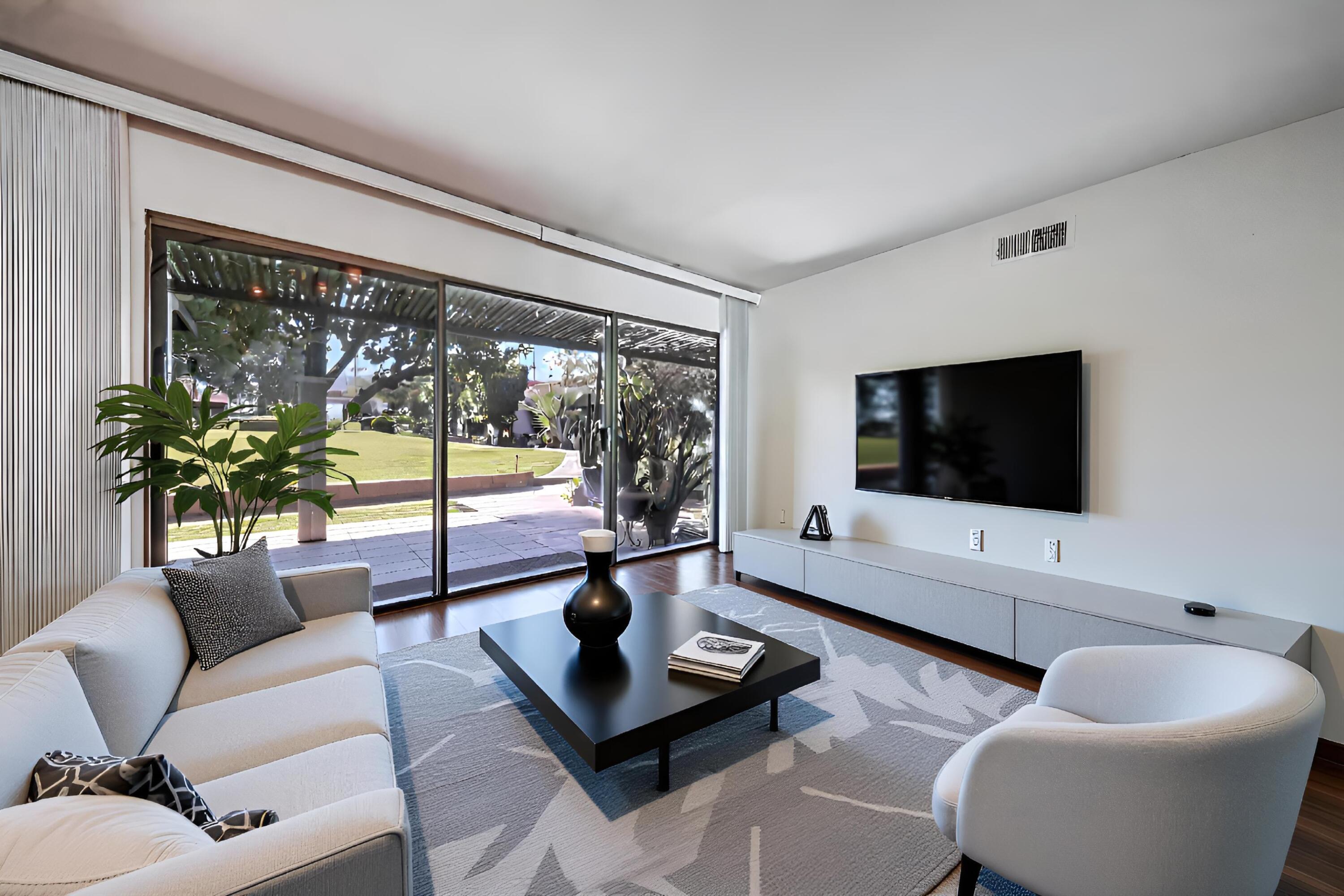45760 Ocotillo Drive Palm Desert, CA 92260 - Photo 9 of 29 a living room with furniture and a flat screen tv