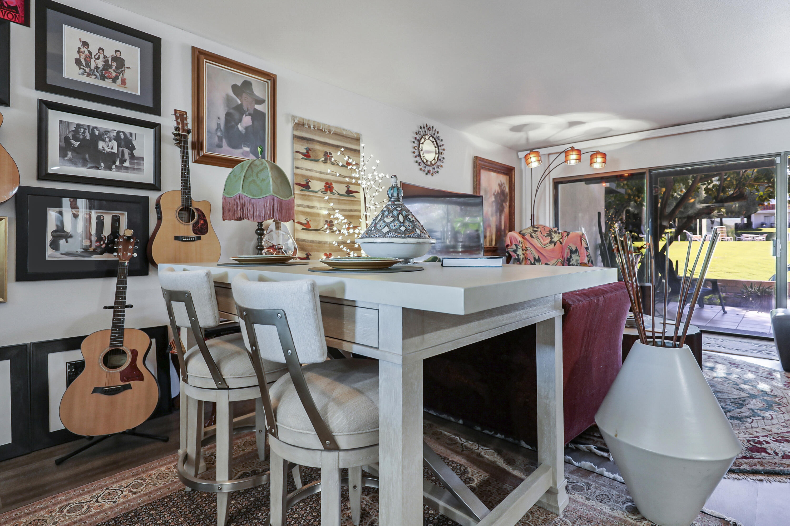 45760 Ocotillo Drive Palm Desert, CA 92260 - Photo 10 of 29 a dining hall with granite countertop a stove and a dining table with kitchen view
