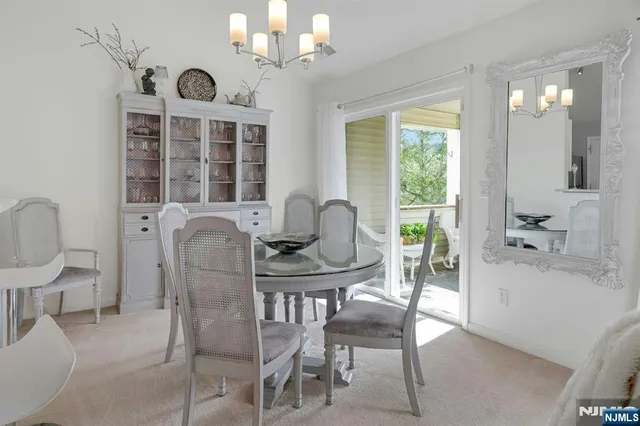 a view of a dining room with furniture window and chandelier