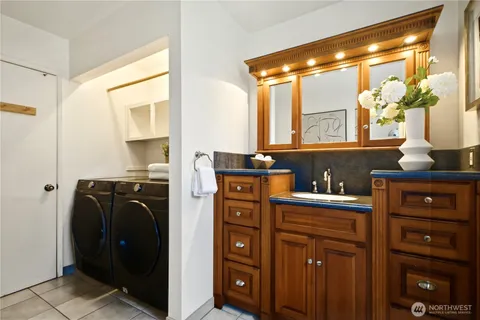 a kitchen with a refrigerator and cabinets