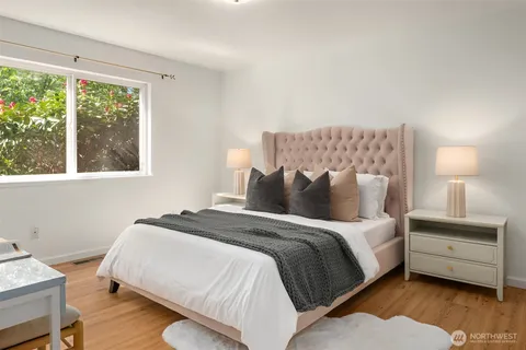 a bed room with a bed and a lamp